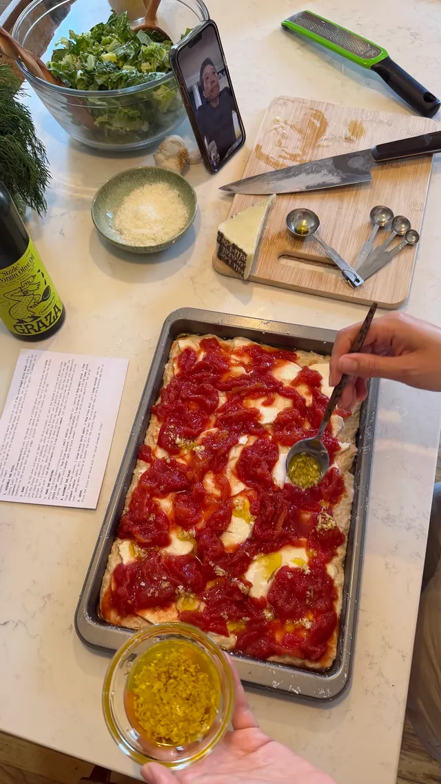 Preparing pizza together on a video call